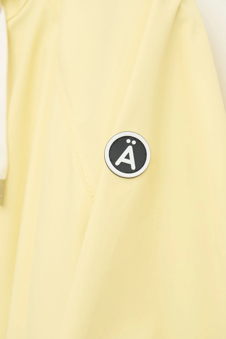 Sky Raincoat in Pale Banana